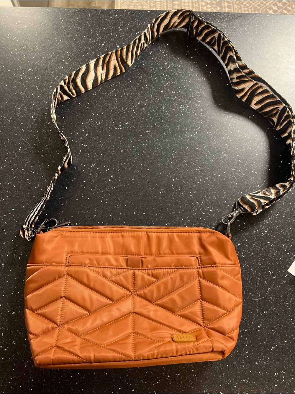 lug Quilted Crossbody Bag in Burnt Orange with Zebra-Print Strap